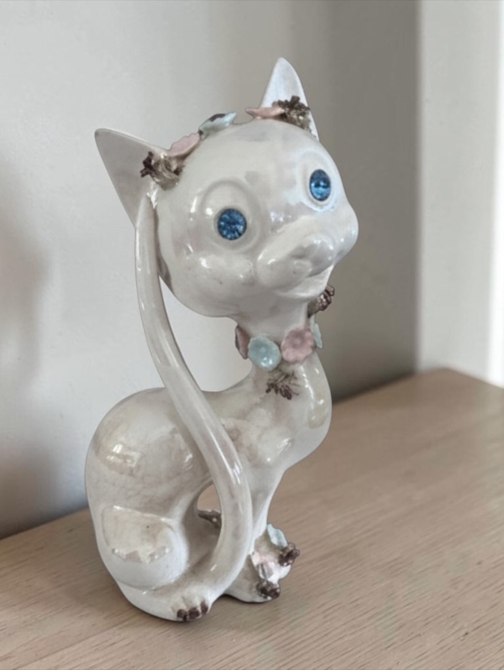 Mid-Century Ceramic Cat Figurine with Blue Eyes and Floral Accents